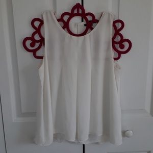 A white sleeveless dress shirt